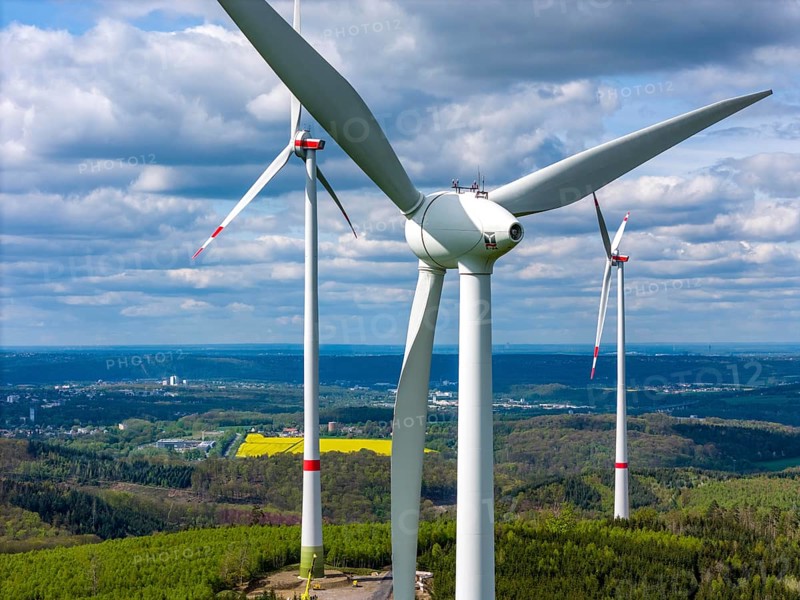 Erection of a wind turbine, wind energy plant, assembly of the ring generator, with a crawler lattice crane, wind farm near Hagen, North Rhine-Westphalia, Germany, Europe