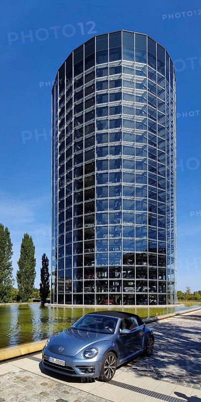 A VW car with car tower for the delivery of new cars on the grounds of the Autostadt, Volkswagen AG, Wolfsburg, Lower Saxony, Germany, Europe