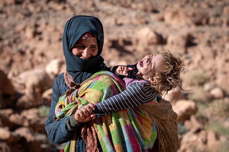 Berber woman, with baby on her back, traditional clothing, Morocco, Africa