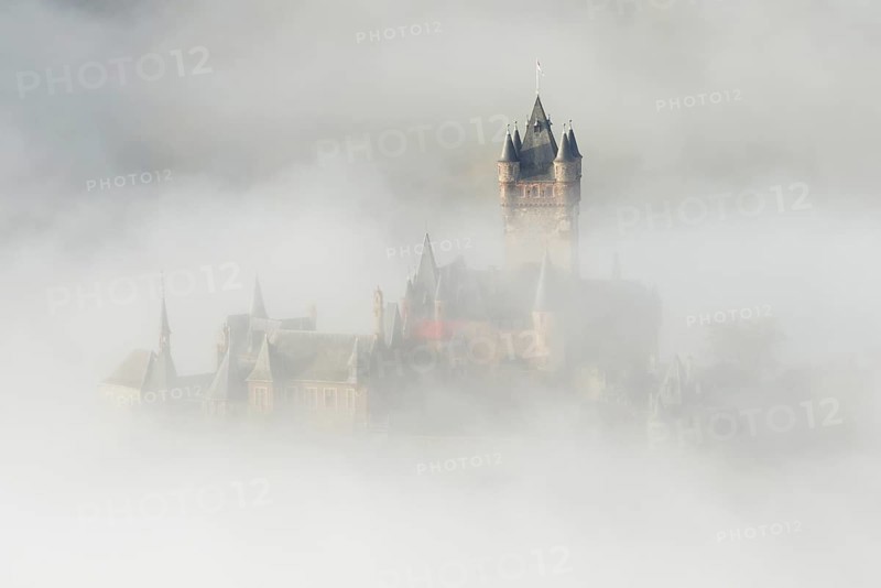 View of the Reichsburg castle near Cochem in dense fog, Moselle, Rhineland-Palatinate, Germany, Europe