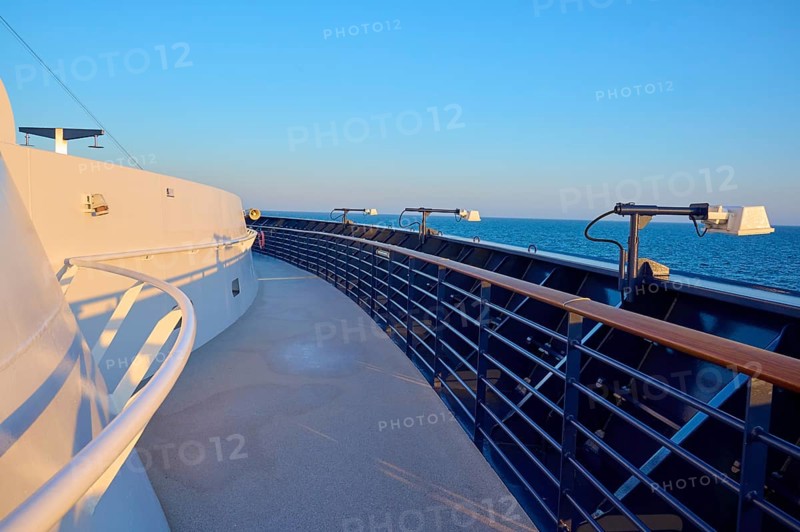 Deck of a cruise ship with clear blue sky and blue railing, Mein Schiff 6, North Sea, Denmark, Europe