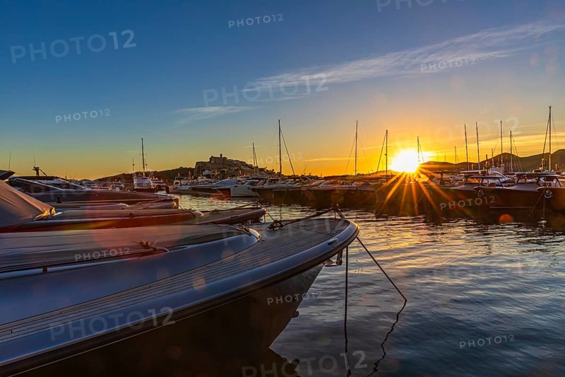Luxury yachts under a low sun in the harbour of Eivissa, Ibiza Town, Ibiza, Balearic Islands, Mediterranean Sea, Spain, Europe
