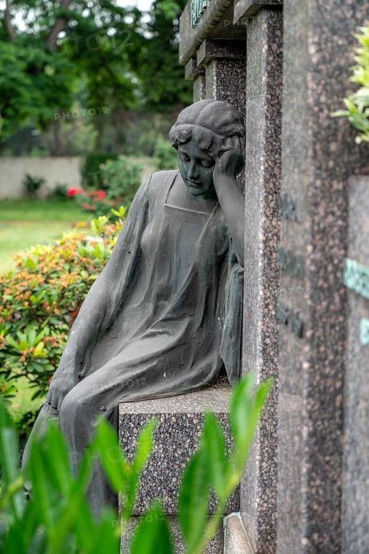 Figure in a cemetery, family grave, old gravestone, with flower and grave light, North Rhine-Westphalia, Germany, Europe