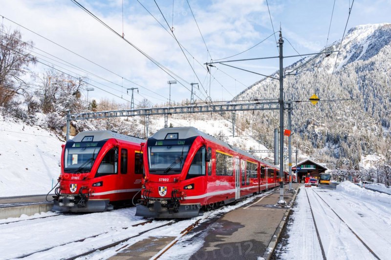 Rhaetian Railway trains on the Albula railway Stadler Rail passenger train at Filisur station, Switzerland, Europe