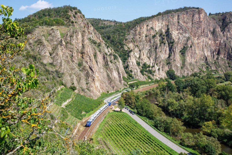 The Rotenfels with an Alstom Coradia LINT regional train operated by Vlexx in Traisen, Germany, Europe
