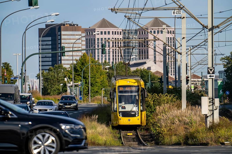 Road traffic, tram on Altendorfer Straße, in the background the town hall, left and the Weststadt towers, in Essen, North Rhine-Westphalia, Germany, Europe