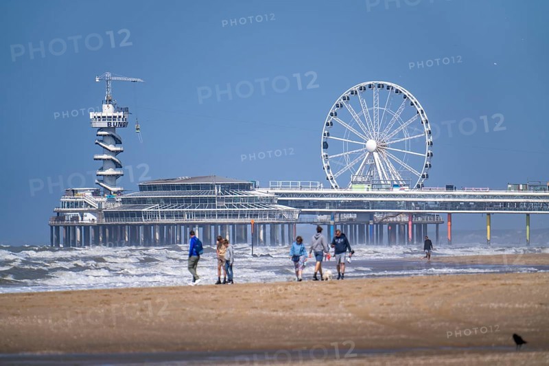 The pier and Ferris wheel at the Scheveningen beach, heavy swell, Netherlands