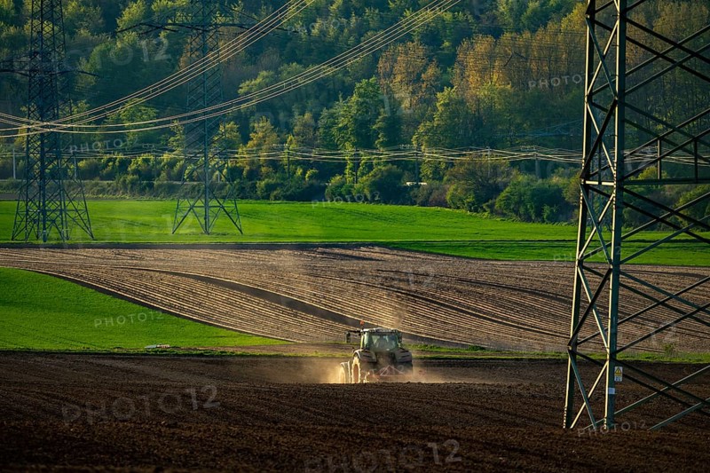 Tractor working a field near Grevenbroich, in spring, Germany, Europe