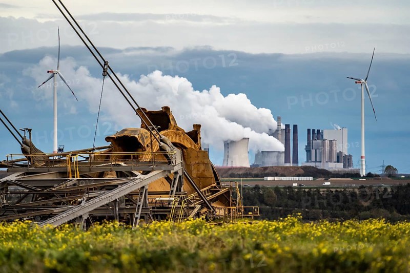 Lignite opencast mine Garzweiler II, bucket wheel excavator dredging, at the edge of the opencast mine near the village of Lützerath, f, wind farm, Neurath lignite-fired power plant, North Rhine-Westphalia, Germany, Europe