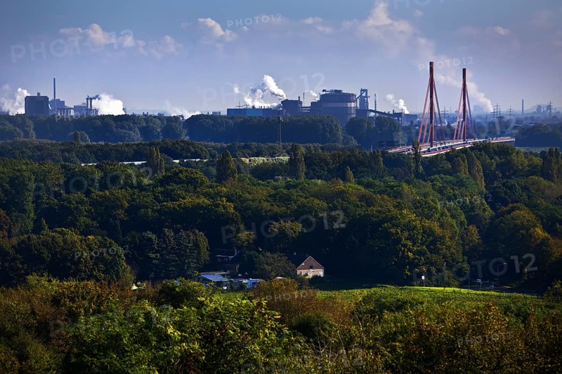 View from the Rheinpreussen spoil tip in Moers to the ThyssenKrupp plant with the bridge of the A 42 motorway in Duisburg, Ruhr area, North Rhine-Westphalia, Germany, Europe
