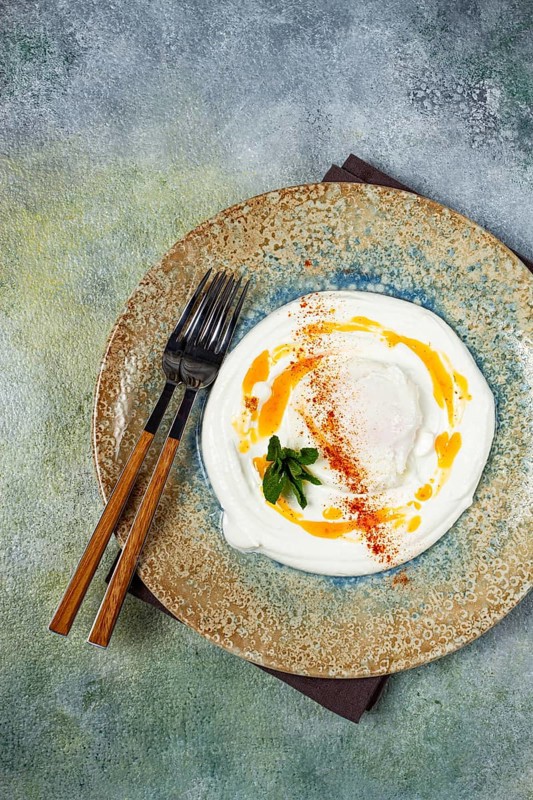 Cilbir, traditional Turkish breakfast, Turkish eggs with yogurt and butter, homemade, no people