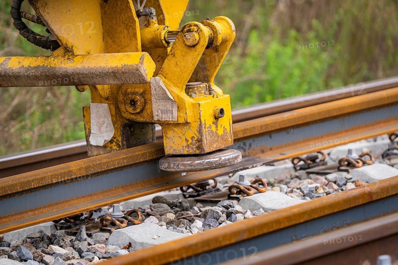 Close-up of a yellow construction machine working on a rail, track construction, Hermann Hessebahn, Calw, Black Forest, Germany, Europe
