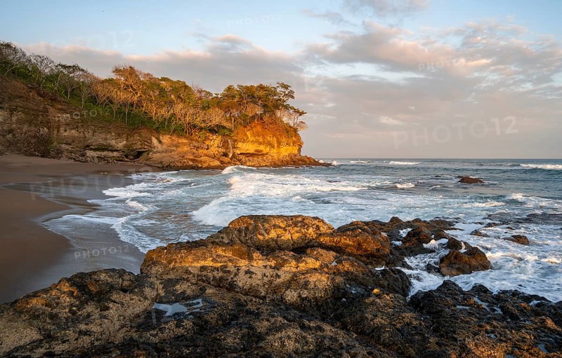 Sandy beach beach with rocks and sea at sunset, Playa Cocalito, coastal landscape, Pacific coast, Nicoya Peninsula, Puntarenas Province, Costa Rica, Central America