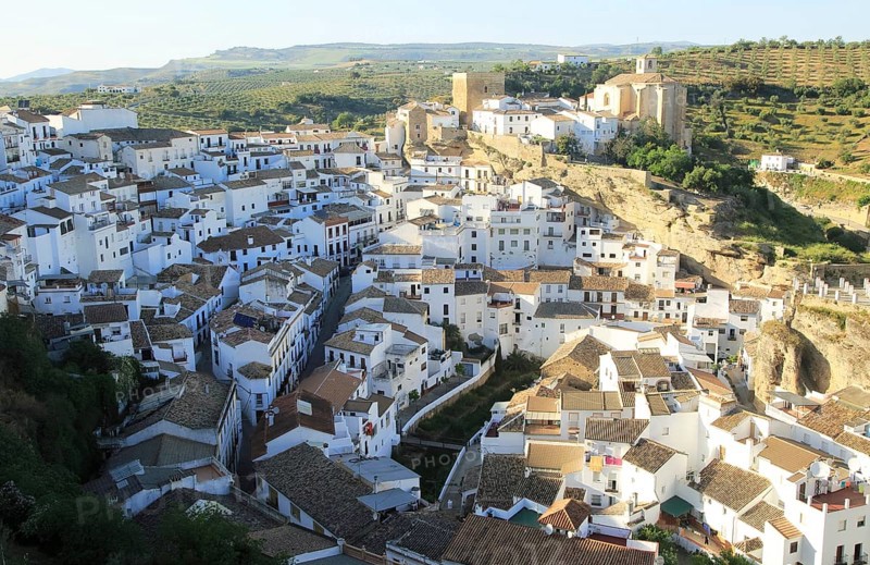 Whitewashed buildings on hillside in village of Setenil de las Bodegas, Cadiz province, Spain, Europe