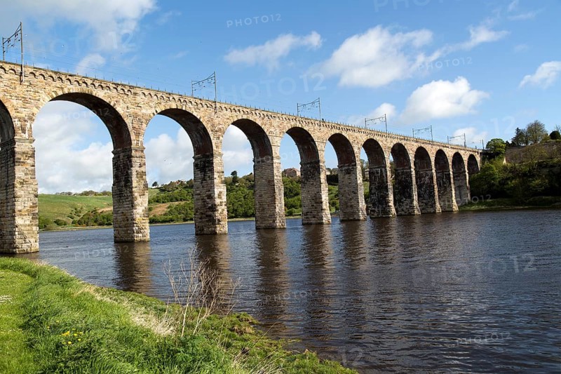 Stone arches of railway viaduct crossing River Tweed, Berwick-upon-Tweed, Northumberland, England, UK