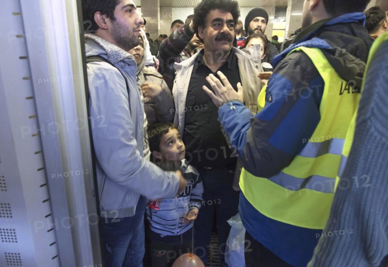 Syrian refugees arrive at Schönefeld station on a special train. They are then taken by bus to accommodation in Berlin, 01.10.2015
