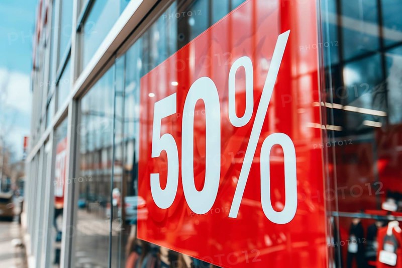 Red sale sign with text '50%' in shopping window. Generative AI, AI generated