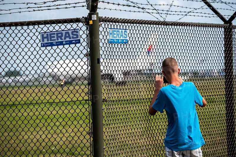 Amsterdam Schiphol Airport, Jet on the taxiway, to the Polderbaan runway, aeroplane spotter taking photos at the fence, Amsterdam, Netherlands