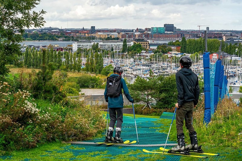 CopenHill, waste incineration plant and artificial ski slope, skiing with a view of Margretheholms Havn marina, ski lift, 90 metres high and 400 metre long slope on artificial turf, Copenhagen, Denmark, Europe