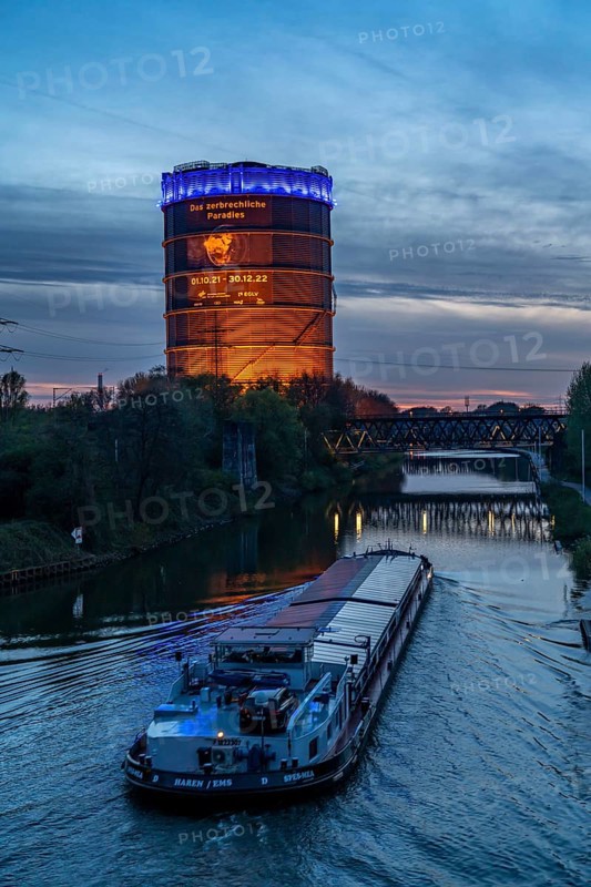 Neue Mitte Oberhausen, Gasometer exhibition hall, after renovation, Rhine-Herne Canal, evening lighting, canal boat, exhibition The Fragile Paradise, North Rhine-Westphalia, Germany, Europe