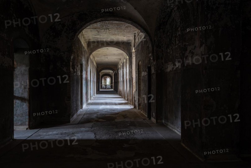 A dark, deserted corridor with vaulted ceilings leads into a mysterious depth, Beelitzheilstätten, former lung sanatorium, Beelitz, Brandenburg, Germany, Europe
