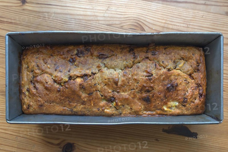 Freshly baked English tea cake with sultanas in a baking tin, Bavaria, Germany, Europe