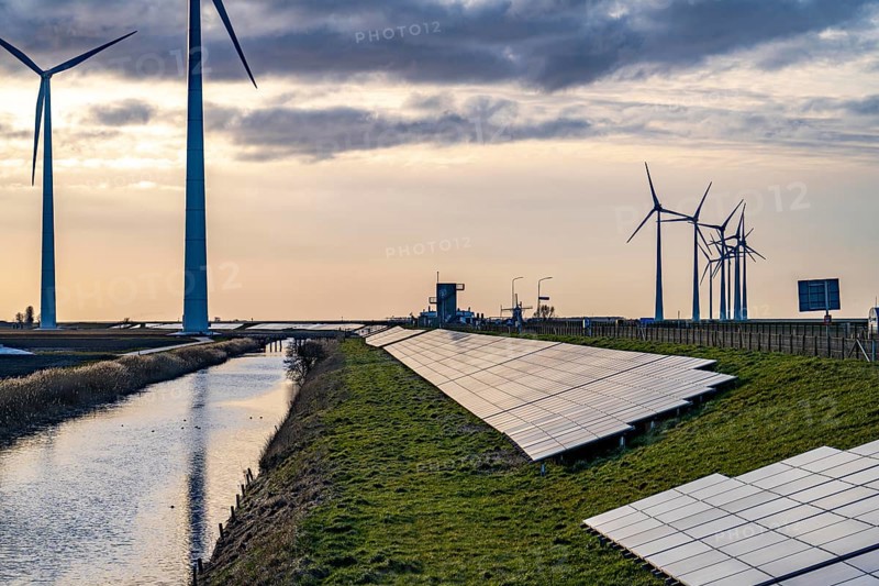Solar park on the Slaperdijk dyke near the Eemshaven, test project, 17, 000 solar modules were installed over a good 5 kilometres, the Netherlands has over 22, 000 kilometres of dyke line, here it is being tested whether such an installation is successful and can be expanded, wind farm, Groningen, Netherlands