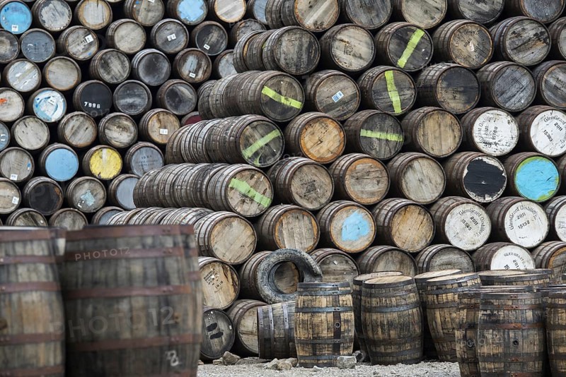 Huge stacks of discarded whisky casks, barrels at Speyside Cooperage, Craigellachie, Aberlour, Banffshire, Grampian, Scotland, UK