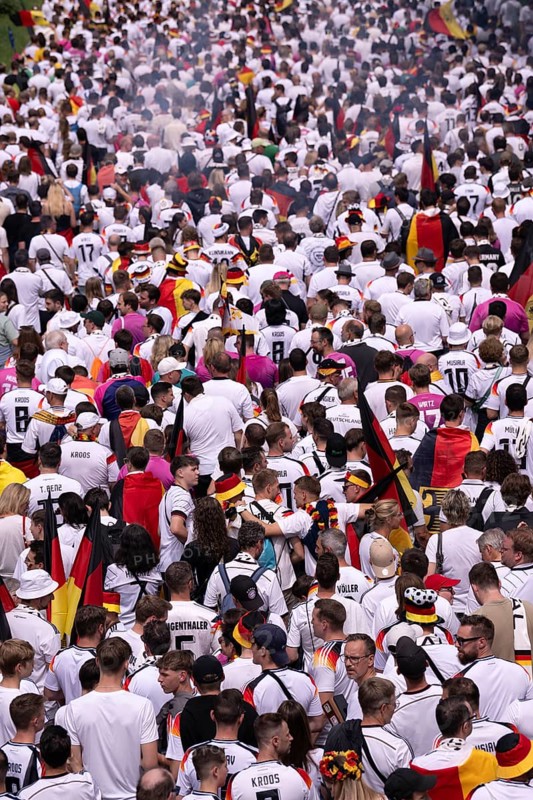 Fan march, from behind, German football fans march to the quarter-final Spain versus Germany, UEFA EURO 2024, European Championship, flags, flags, atmosphere, atmospheric, fan club DFB, German Football Association, B14, Cannstatter Straße, Stuttgart, Baden-Württemberg, Germany, Europe