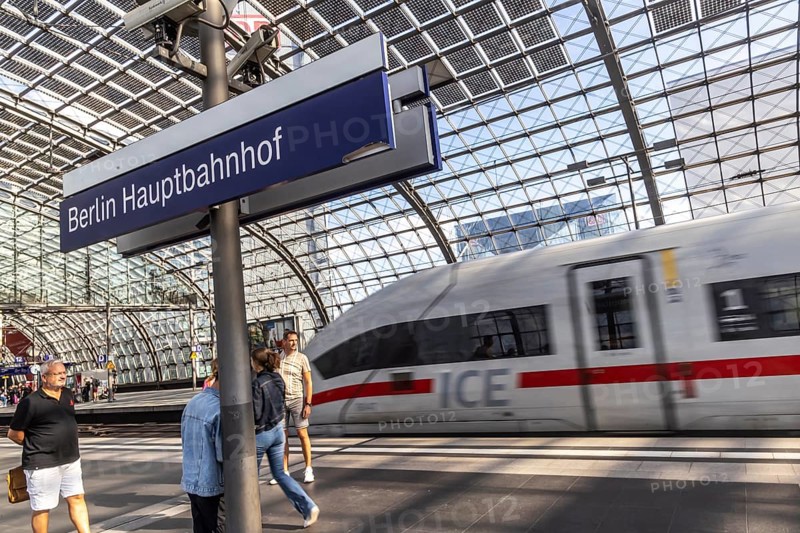Central station with platform hall with glass roof construction with integrated photovoltaic system, ICE, station sign, Berlin, Germany, Europe