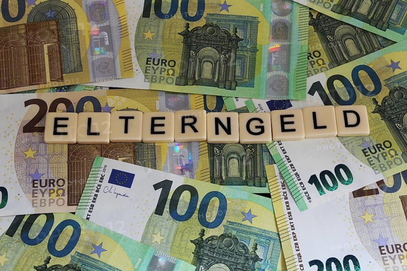 Symbolic image of parental allowance: Letters on euro notes show the word parental allowance