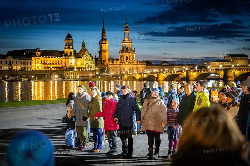 On 13 and 14 February 1945, Dresden was heavily destroyed in three Allied bombing raids. Every year, the people of Dresden commemorate this event at various events. A long human chain symbolised the protection of the city centre. Here looking from the Königsufer across the Elbe to the Old Town, Dresden, Saxony, Germany, Europe