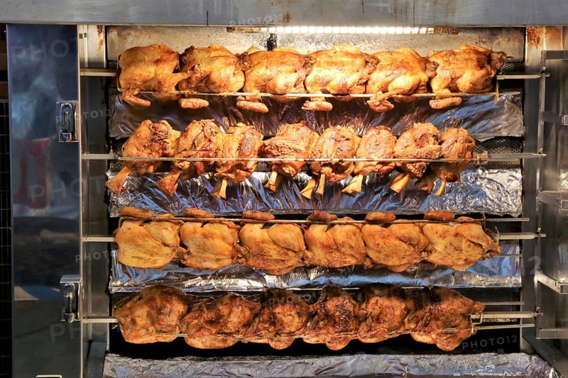 Grilled knuckle of pork and chicken on the spit