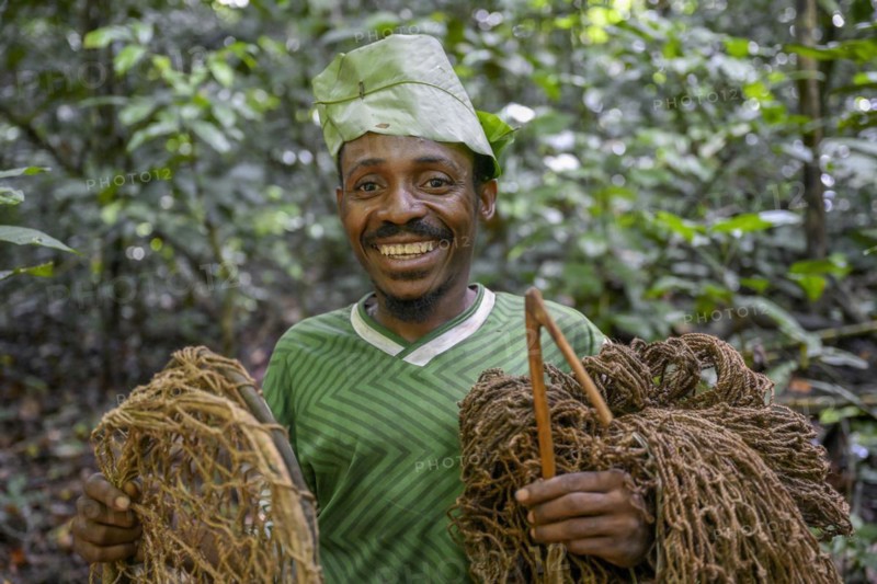 Pygmy of the Baka or BaAka people with his traps and hunting nets in the forest, Dzanga-Sangha Special Dense Forest Reserve, Sangha-Mbaéré Prefecture, Central African Republic, Africa