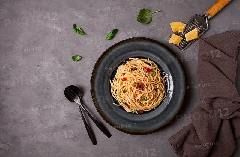 Pasta with tomato sauce and cheese, Italian traditional dish, close-up, no people