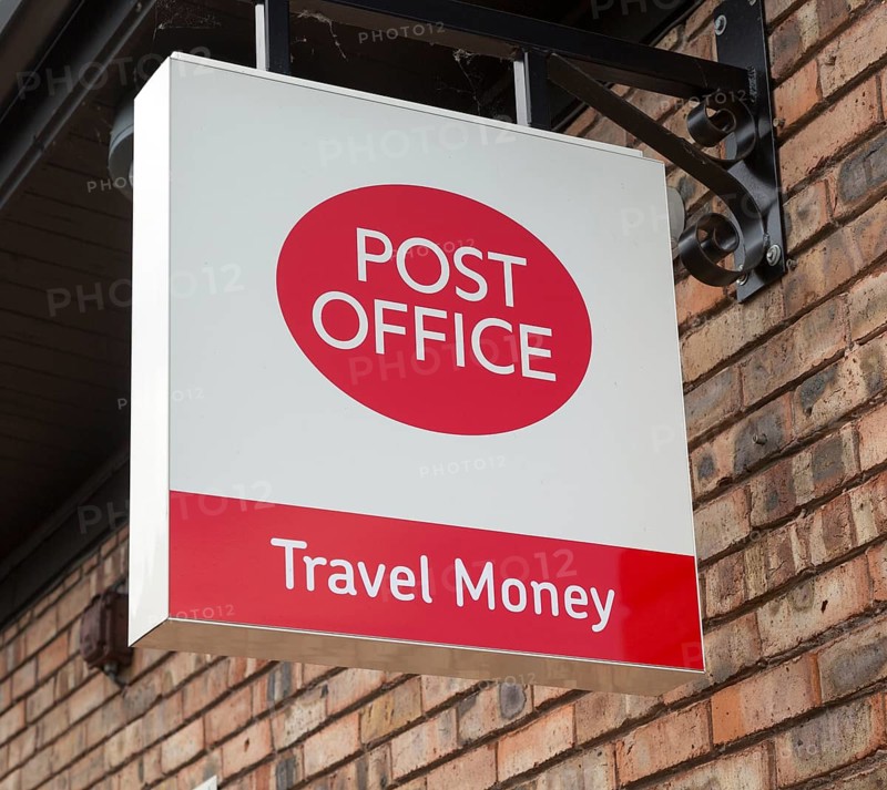 Close up Post Office travel money sign, Woodbridge, Suffolk, England, UK