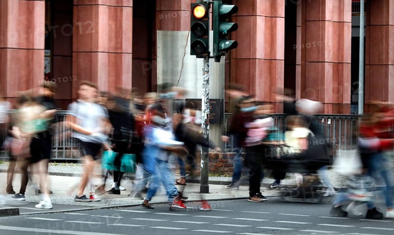 Dense crowds around Alexanderplatz. People with masks. Difficult to keep the distance rule. Don't get infected. Germany is slowly opening up again. Shops, cafés, restaurants, shopping centres are now allowed to reopen, Berlin, 22.05.2020