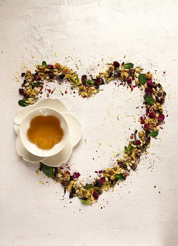 Tea set, heart-shaped, with a cup, top view, on a white background, rosebuds, jasmine, blue, chrysanthemum, mint leaves