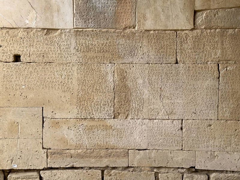 Detailed view of sandstone blocks Stones made of sandstone with written laws carved into the wall of the archway behind the amphitheatre City law of Gortys carved in stone Gortyn law book Large inscription, written in Doric dialect alternately from left to right and right to left, oldest discovered legal text in Europe, Gortyna, Crete, Greece, Europe