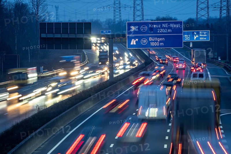 A57 motorway near Kaarst in the Rhine district of Neuss, view in the direction of the Büttgen junction, heavy evening traffic, overhead power lines, along the motorway, North Rhine-Westphalia, Germany, Europe