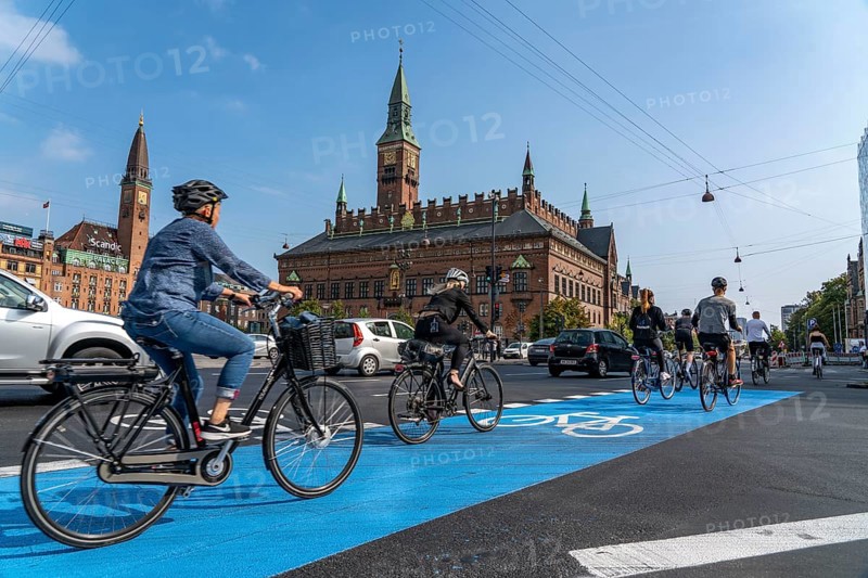 Cyclists on cycle paths, Radhuspladsen, City Hall Square, in the city centre of Copenhagen, considered the cycling capital of the world, 45 % of the inhabitants travel by bike, Denmark, Europe