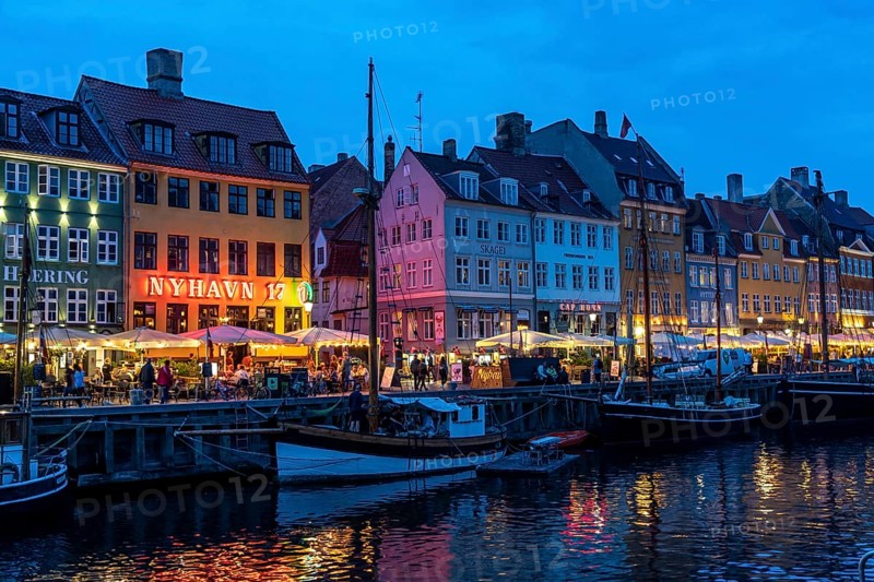 Nyhavn, in the Frederiksstaden district, in the evening, harbour district with houses over 300 years old, promenade with many cafés, pubs, restaurants, canal, tourist attraction, Copenhagen, Denmark, Europe