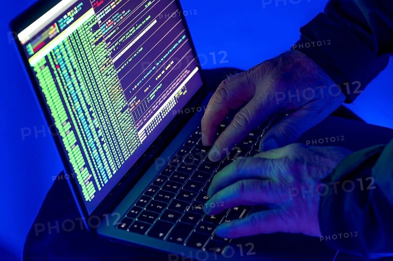 Symbolic image cyber attack, computer crime, cybercrime, computer hackers attack a network, computer, IT infrastructure
