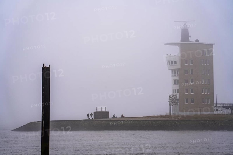Thick fog in winter, hanging over the mouth of the Elbe into the North Sea, radar tower of the Cuxhaven Waterways and Shipping Authority (WSA), at the Alte Liebe viewpoint in Cuxhaven, Lower Saxony, Germany, Europe