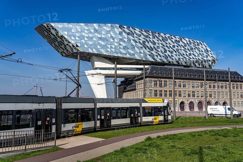 The Antwerp Port Authority building, Havenhuis, former fire brigade barracks in the harbour, renovated and with an attached glass structure in the shape of a ship's hull, administrative headquarters of the Antwerp Port Authority, designed by Zaha Hadid, Antwerp, Flanders, Belgium, Europe