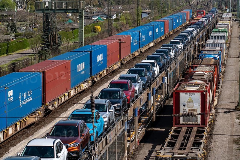 Duisburg-Rheinhausen freight station, at the Logport harbour area, goods trains loaded with new cars, various tank containers and the container train from China, on its way to the Logport, part of the new Silk Road, Duisburg, North Rhine-Westphalia, Germany, Europe