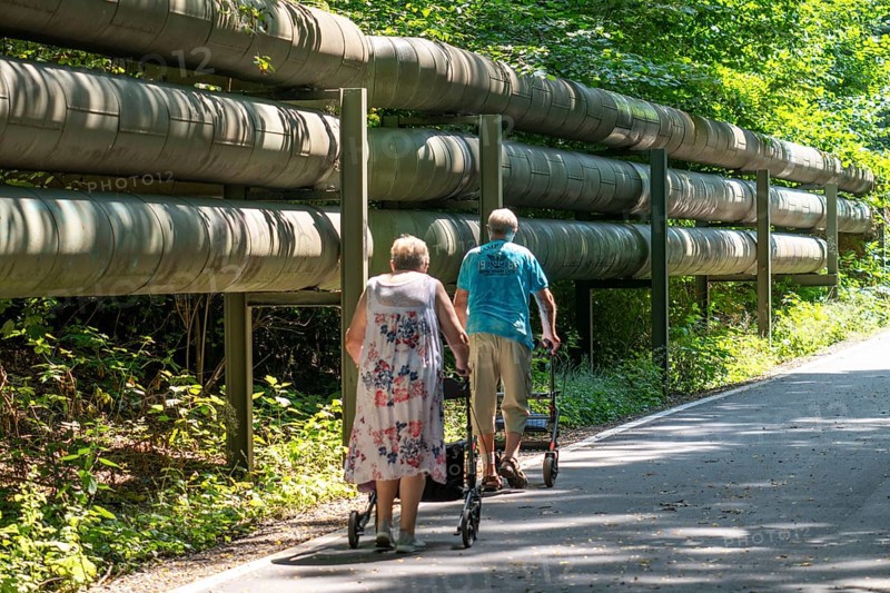 Lothringentrasse, in the north of Bochum, Bochum-Grumme, district heating lines, senior citizens with rollator on a walk, former railway line, connects the southern cycle paths with the north, Bochum North Rhine-Westphalia, Germany, Europe