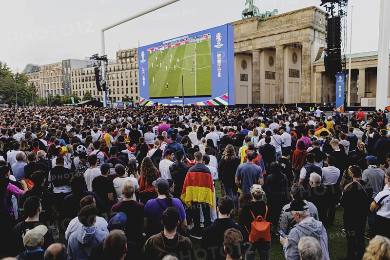 Fans react during the European Championship preliminary round match between Germany and Hungary on the fan mile in front of the Brandenburg Tor in Berlin, 19 June 2024
