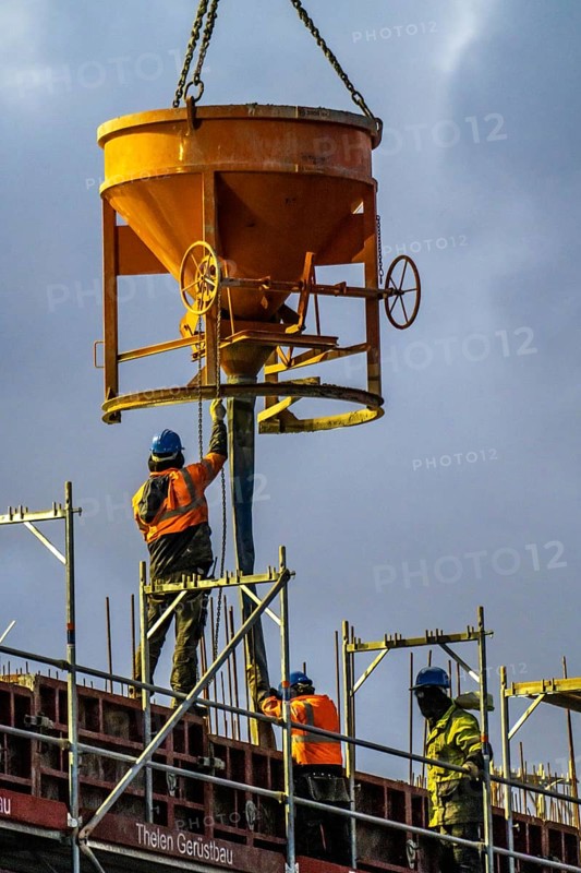 Concrete work, at dusk, on a large construction site building a residential and commercial complex, North Rhine-Westphalia, Germany, Europe