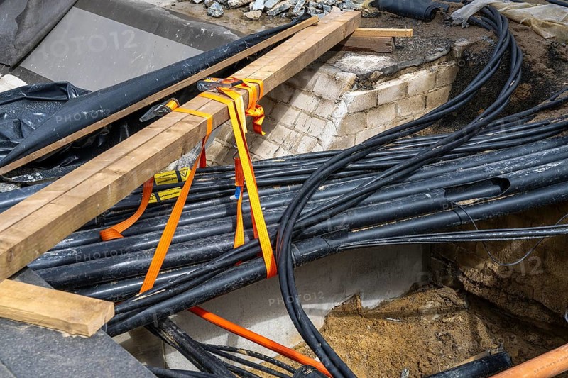 Supply lines, laid underground, exposed during a construction project, Bochum, North Rhine-Westphalia, Germany, Europe